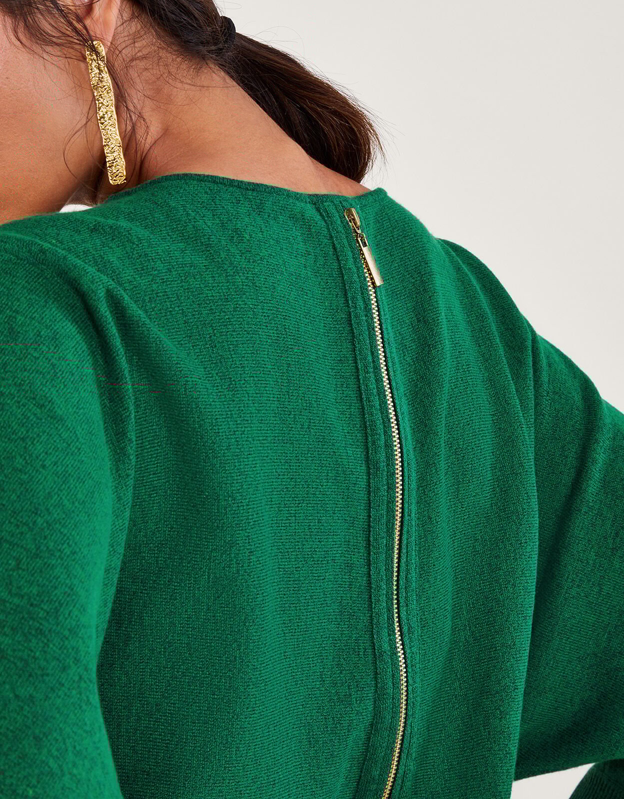 Sweater with zipper down the back top