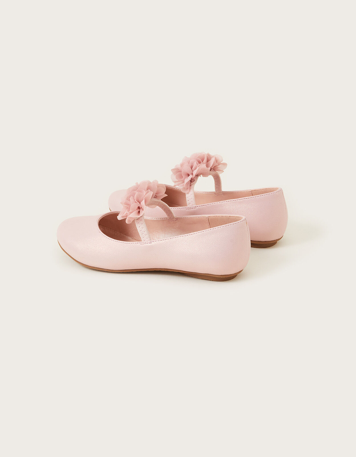 Blush colored flat shoes top
