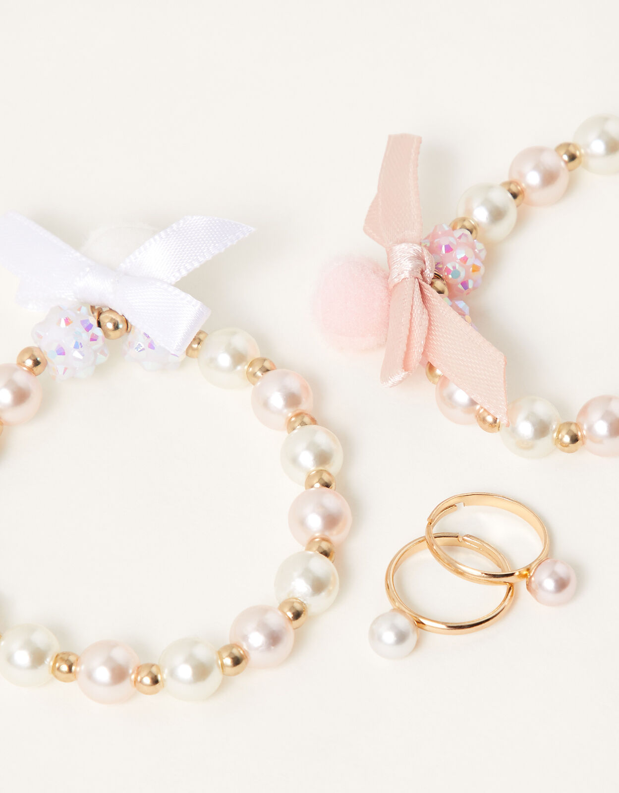 Pom pom bracelet with ring on sale