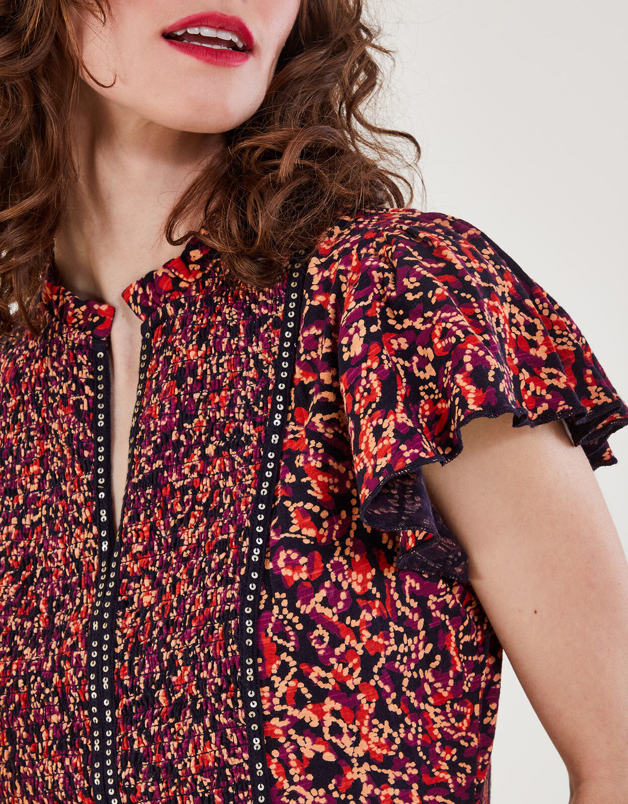 Red embellished shop top