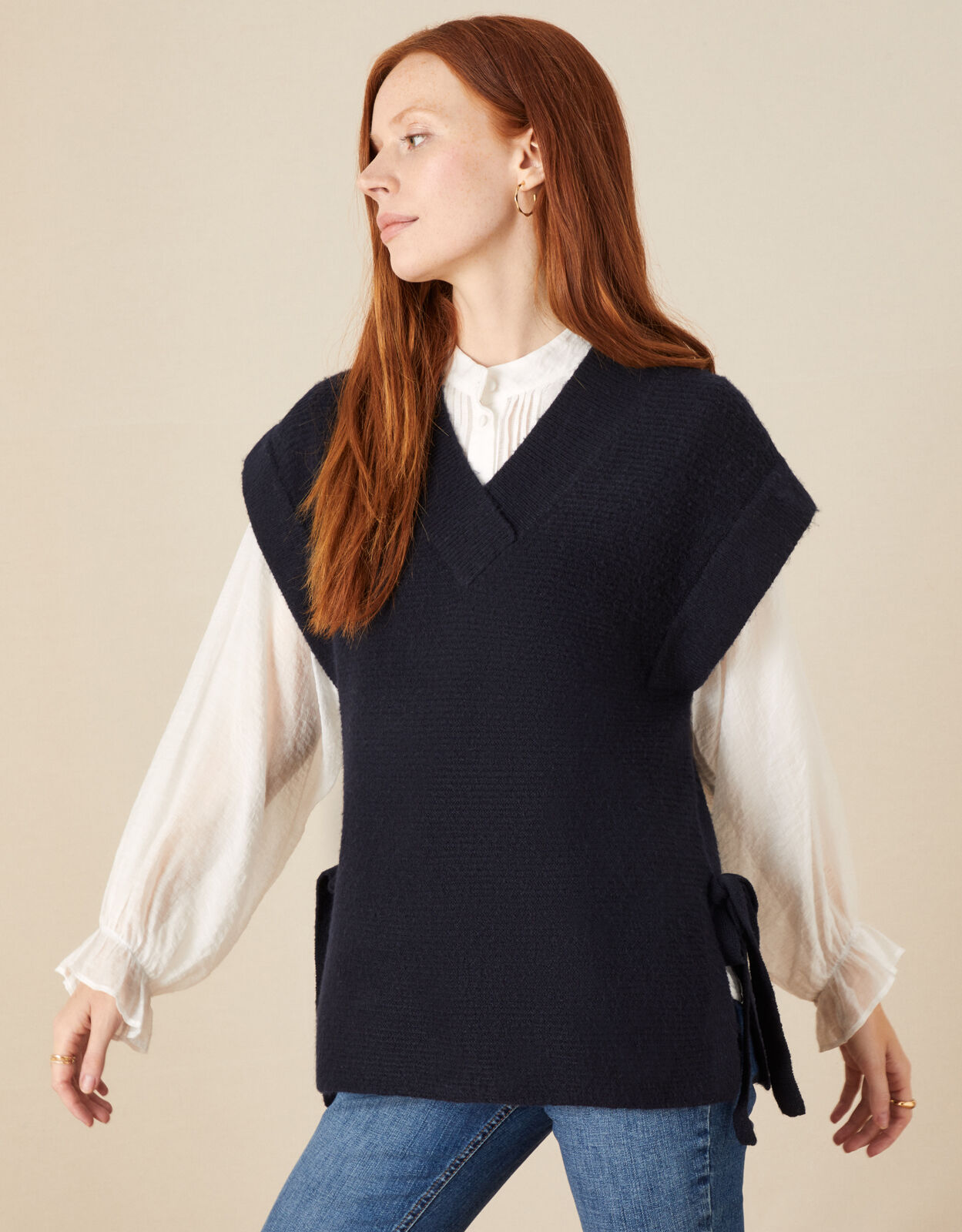 Womens knitted sleeveless hotsell jumper