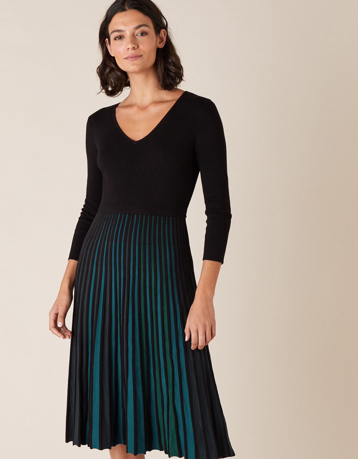Black dress shop with coloured pleats