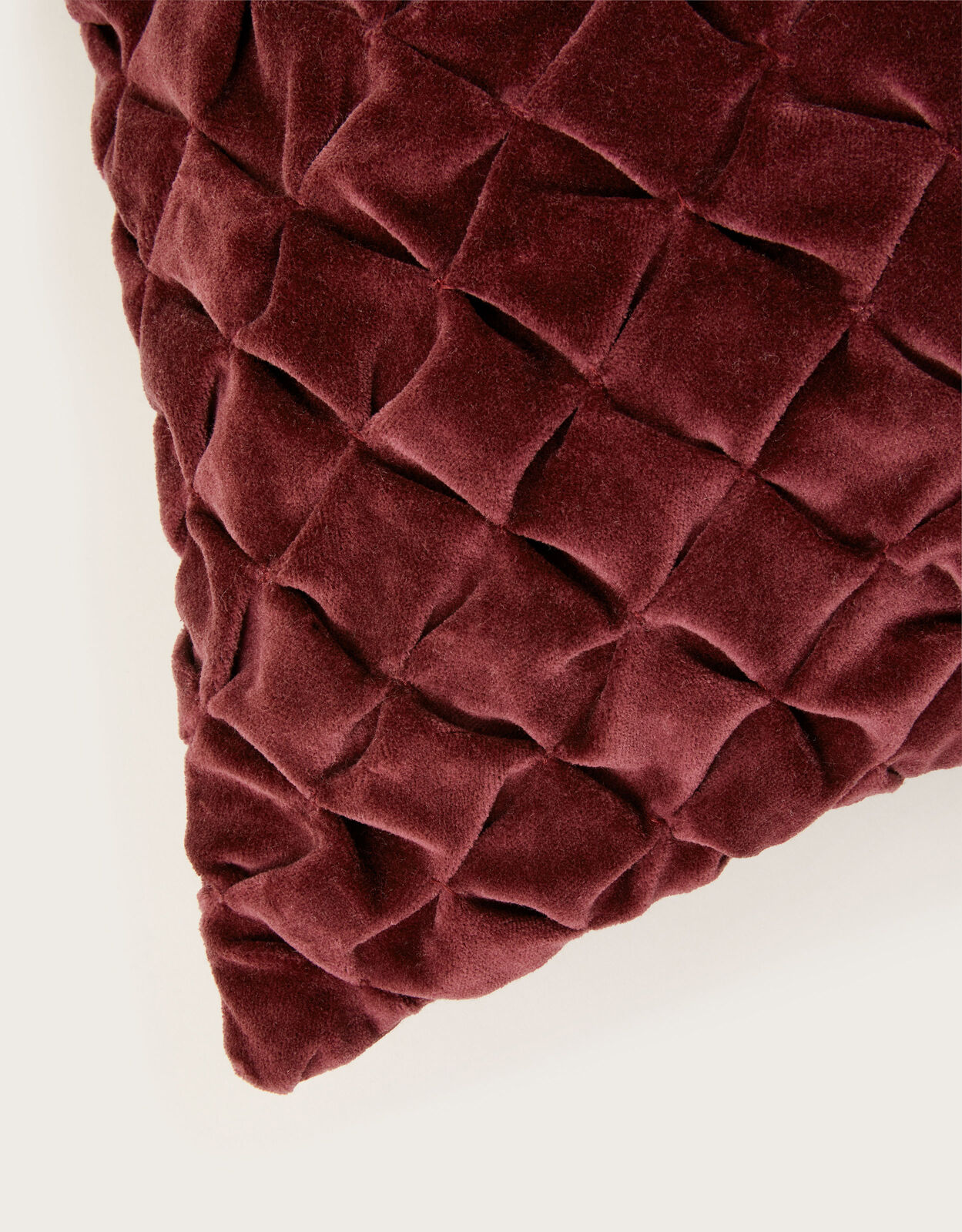 Burgundy velvet shop cushion