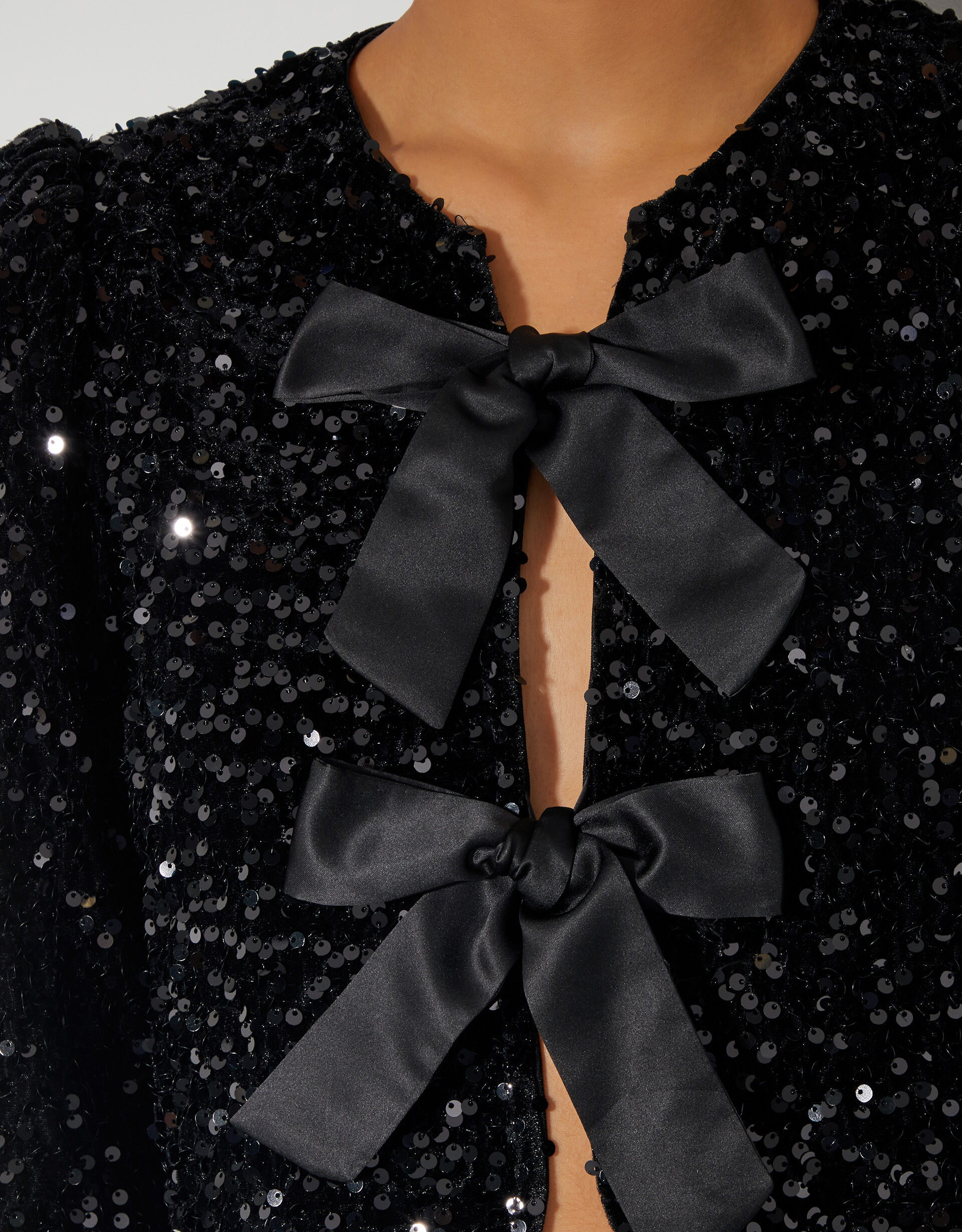 Belinda Bow Sequin Jacket Black | Jackets | Monsoon US.