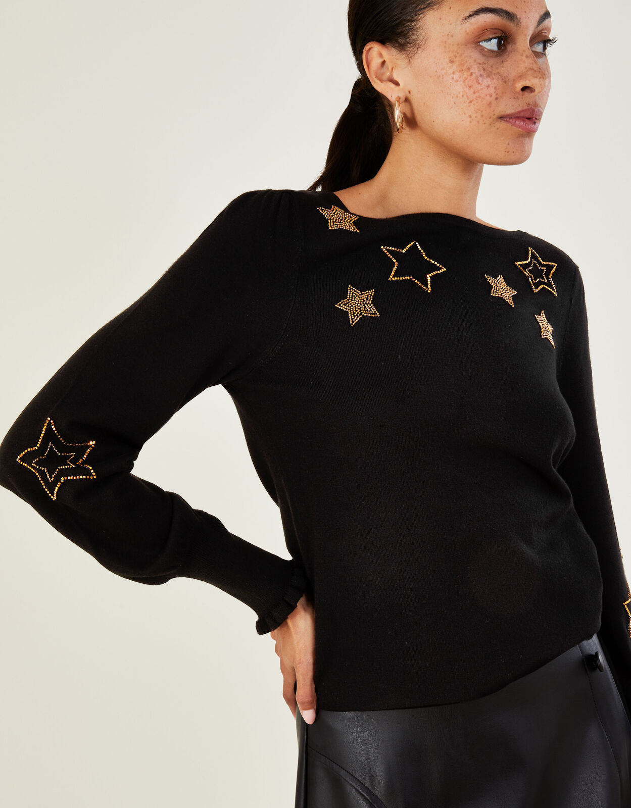 Black jumper on sale with stars